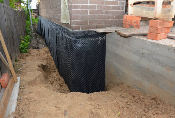 SJ Waterproofing Pros technician performing targeted Exterior Waterproofing assessment in Lannon, WI